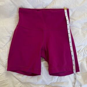 Lululemon Wunder Train High-Rise Shorts in a vibrant magenta